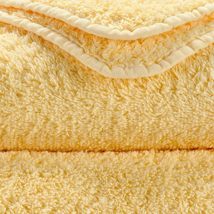 Luxusní ručník z egyptské bavlny v jemném krémově žlutém odstínu Popcorn Super Pile Abyss & Habidecor Waterfall Bathrooms