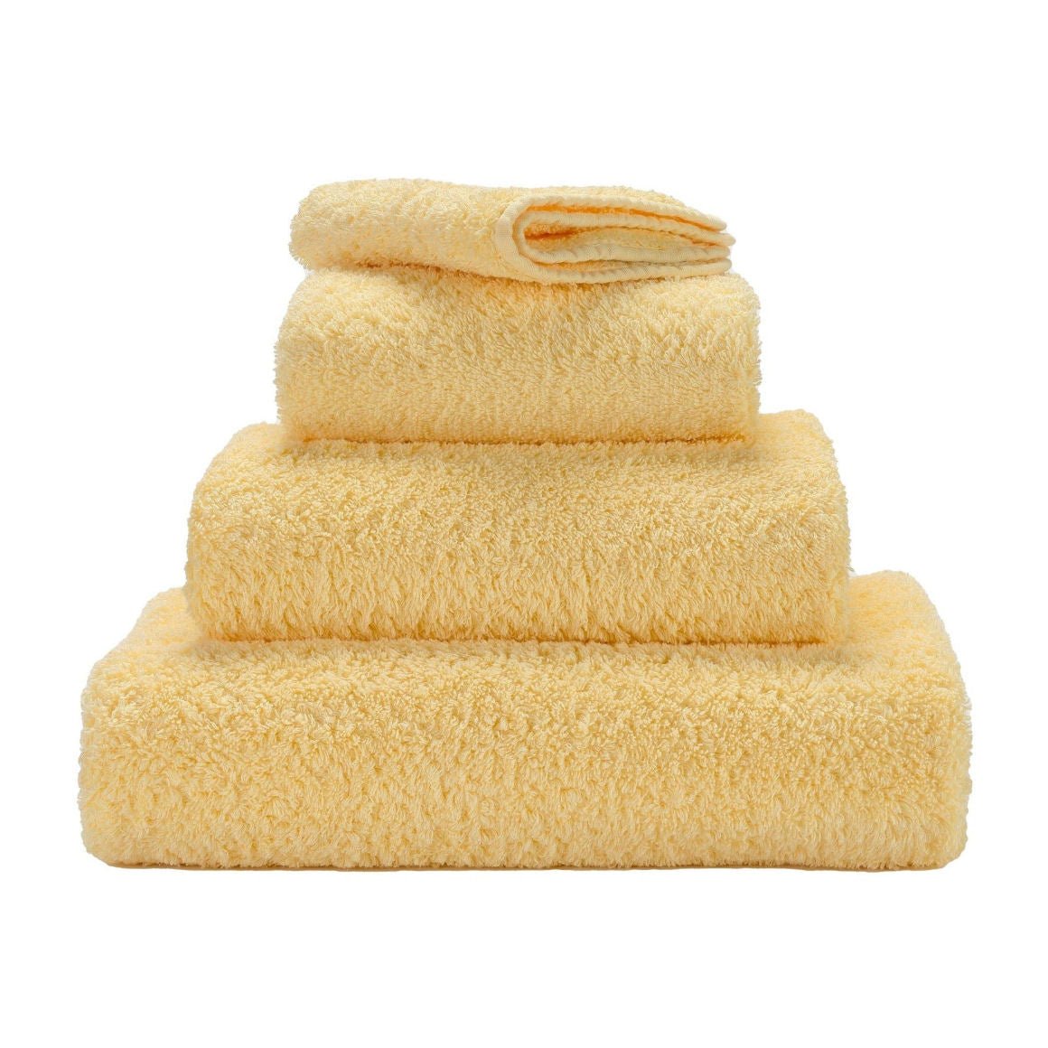 Luxusní ručník z egyptské bavlny v jemném krémově žlutém odstínu Popcorn Super Pile Abyss & Habidecor Waterfall Bathrooms