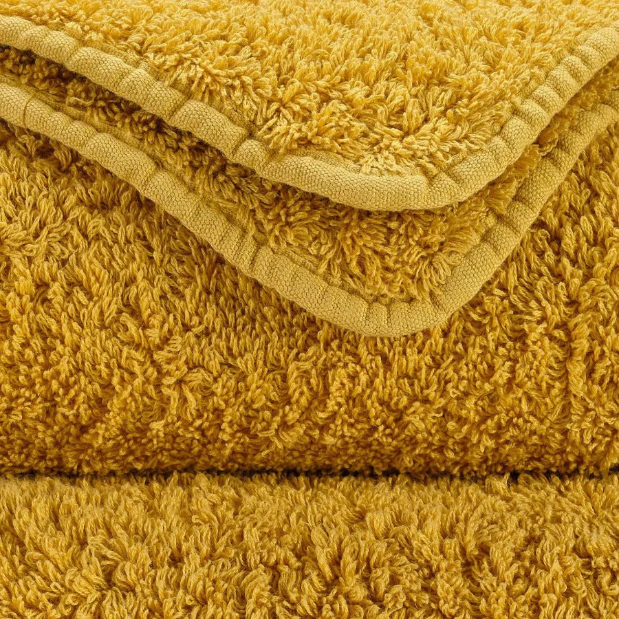 Luxusní ručník z egyptské bavlny v sytém šafránovém odstínu Safran Super Pile Abyss & Habidecor Waterfall Bathrooms